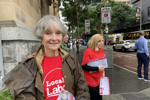 Former Labor senator Claire Moore helps hand out how-to-vote cards at Brisbane’s City Hall amid pre-polling this week.