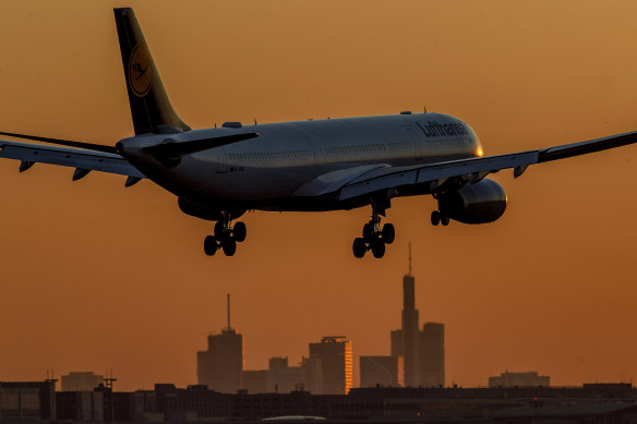 A Lufthansa aircraft approaches the airport in Frankfurt, Germany, at sun rise.
