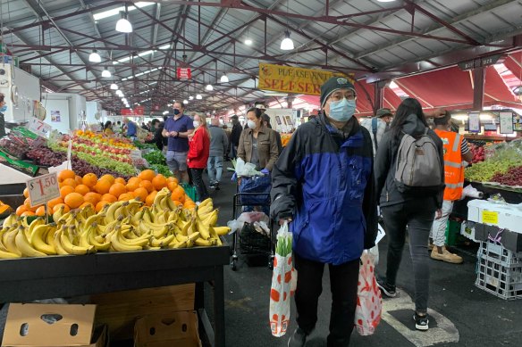 Masked-up Melburnians at Queen Victoria Market’s fruit and vegetable section late last year.
