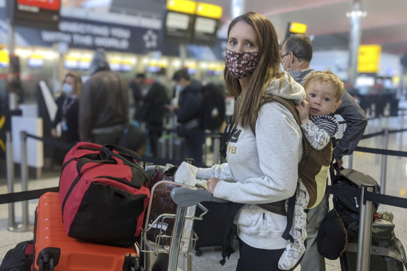 Kate Smith with her one-year-old son Lleyton at Heathrow Airport checking in for flight QF110 for Darwin.