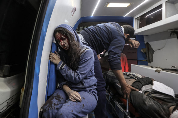 Injured Palestinians, including children and women, are taken to the Al-Aqsa Martyrs Hospital for treatment as Israel launches large-scale airstrikes across the Gaza Strip.