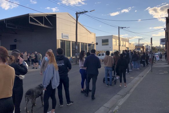 People line up for takeaway drinks at Brogan’s Way takeaway in Richmond on Sunday.