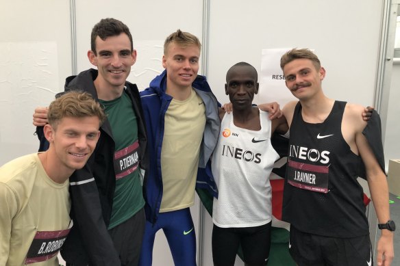 Brett Robinson, Pat Tiernan, Stewart McSweyn, Eliud Kipchoge and Jack Rayner celebrate after the race.