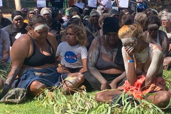 Local members of the community mourn the death of Warlpiri man Kumanjayi Walker in Alice Springs on Thursday.