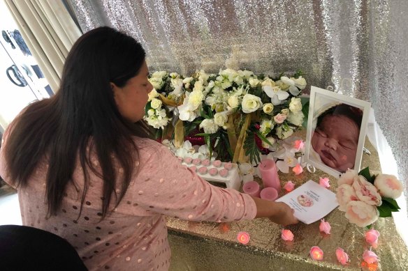 Jennifer Fonua with photos of her stillborn daughter Thalia.