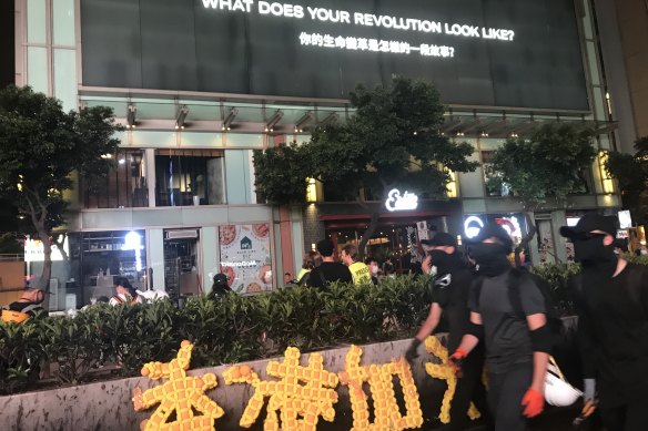 Hong Kong protesters on Nathan Road in Mongkok on Saturday night.