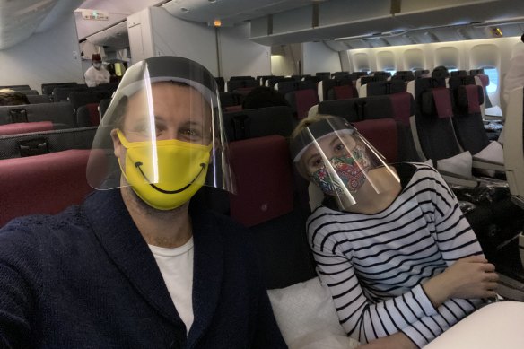 Tom McNamara with his fiancee on their flight home. 