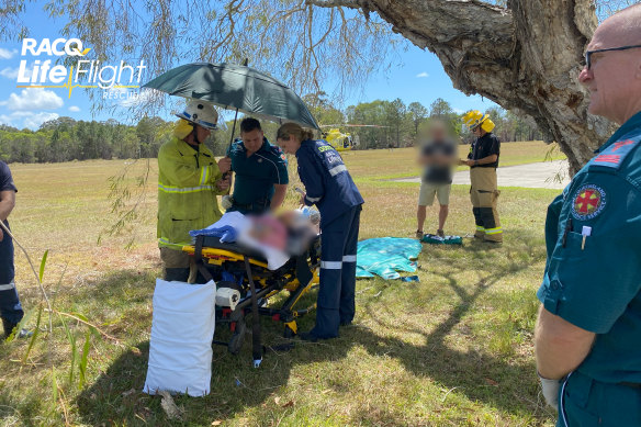 Paramedics tend to one of the crash victims.