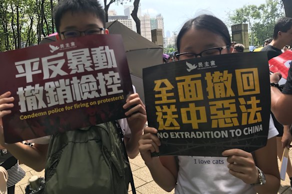 These school students are afraid to show their faces in a picture because of government threats that protesters will be arrested.
