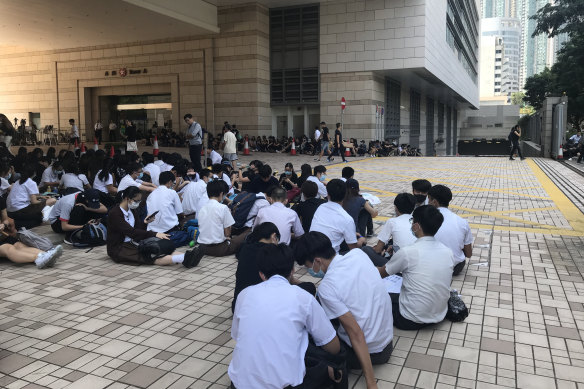 Students boycott classes to sit outside West Kowloon Magistrates Court.