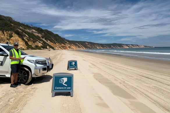 Principal ranger Emma Barraclough operates automatic number plate recognition cameras on Cooloola National Park’s Rainbow Beach. A similar service is soon to begin on K’Gari, (Fraser Island) to track visitors.