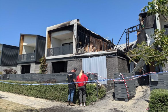 Abbey Forrest's sister, Emily, and her partner lay flowers and a small toy outside the remains of the house on Thursday, "just to symbolise our niece, her daughter, who didn't get to live her full life".