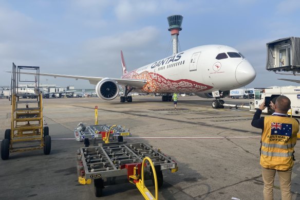 A Qantas flight carrying the first 450,000 doses of the 4 million Pfizer vaccines the UK has agreed to send to Australia sitting on the tarmac at Heathrow Airport on Saturday. 