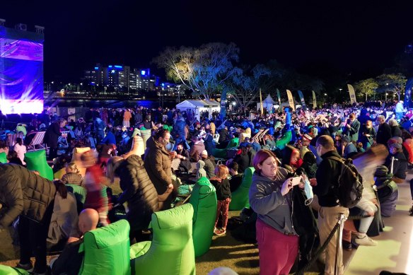 A crowd at South Bank, Brisbane, await the decision of the International Olympic Committee