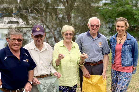 Maree Cadman, far right, and other locals cleaning up the Moruya River on Clean Up Australia Day in 2019.