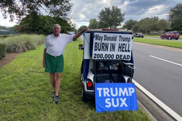 Ed McGinty has become notorious in The Villages for his anti-Trump golf cart signs.
