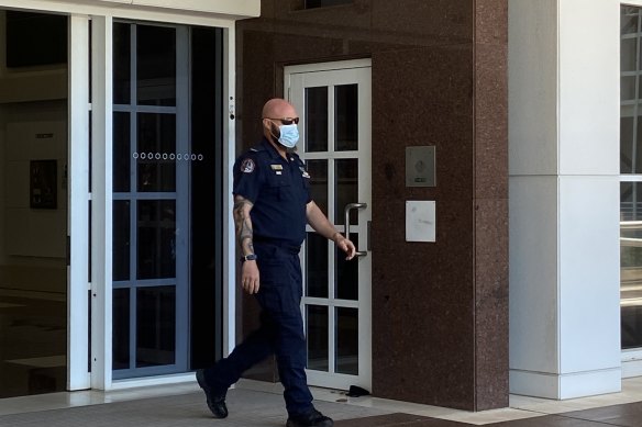 Constable James Kirstenfeldt leaves court in Darwin on Tuesday.