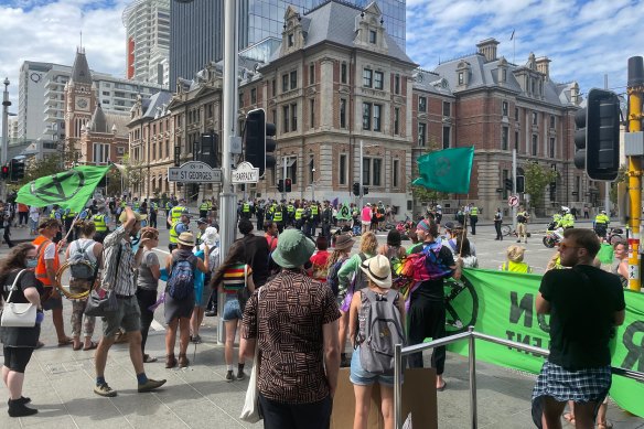 Police have moved in on Extinction Rebellion protestors who held a “die-in” on St George’s Terrace.