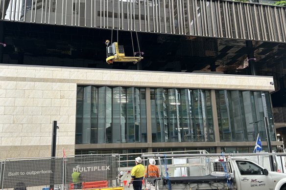 Construction continues on the Luxe Box and three-story retail complex at Queen’s Wharf Brisbane. It was meant to open in late 2022.