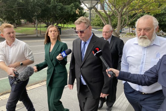 Robert Eickenloff leaves Brisbane District Court after avoiding jail and instead being ordered to do community service.