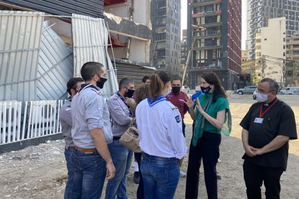 Australian ambassador to Lebanon Rebekah Grindlay briefs volunteers near the site of the massive explosion that rocked Beirut in August.