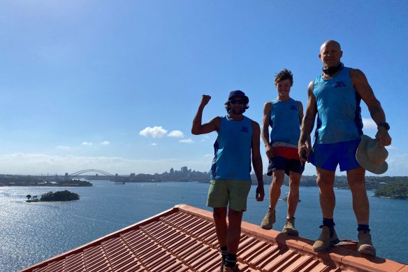 The team from Tim and Terry Tilers- 
(from left) Cody Costello, Harley Levasseura and Nathan Partridge  replaced the heritage roof tiles on a Point Piper 1930s apartment block. 
