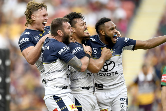 Nanai, second from right, celebrates a Cowboys try.