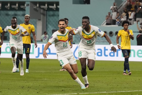 Senegal’s Ismaila Sarr (right) after burying a penalty against Ecuador.