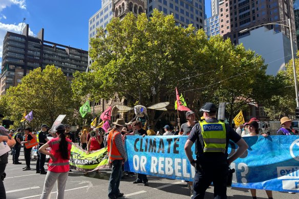 Extinction Rebellion demonstrators on Collins Street during Saturday’s rally.