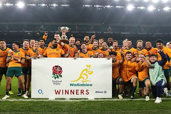 The Wallabies celebrate with the Ella Mobbs Cup after their victory.