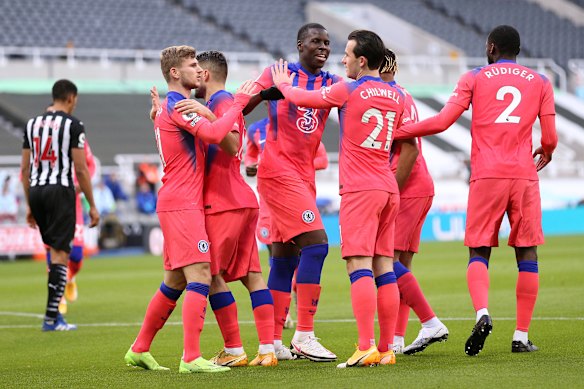 Chelsea celebrate the own goal that got them on the board against Newcastle.