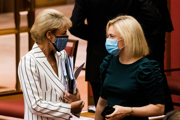 Attorney-General Michaelia Cash speaks to Liberal senator Amanda Stoker on Thursday.