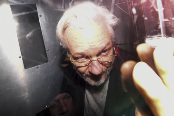 Julian Assange leaves in a prison van after appearing at Westminster Magistrates' Court.