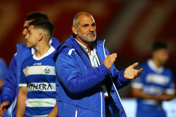 Steve Georgallis applauds his players after their loss to France.