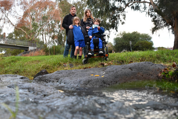 'The creek is dead': Yarraville resident  Claire Halford at Stony Creek with partner Hayden Davies and children Owen, 11, front right, and Ned, 9.