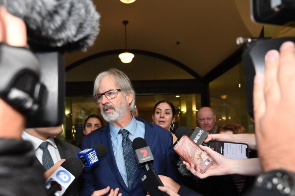 John Jarratt speaks to the waiting media pack after he was found not guilty.