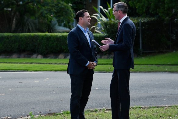 NSW Premier Dominic Perrottet (right) talks with Stuart Ayres at a media event on Monday.