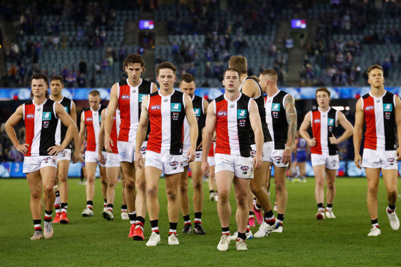 The Saints leave the field after their 111-point loss.