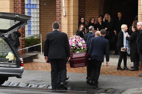 Coffin bearers carry Courtney Herron's coffin into the the St Dimitrios Greek Orthodox Church