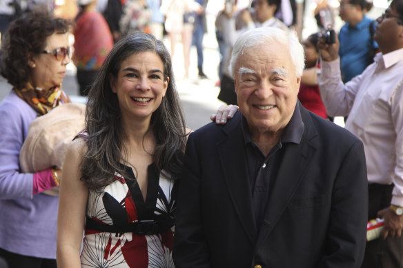  Arthur Frommer with his daughter Pauline posing among tourists in the Wall Street area in New York in 2012.
