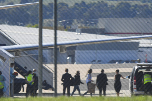 Passengers, including one believed to be Dr Moore-Gilbert, leave a government jet at Canberra Airport in November 2020.