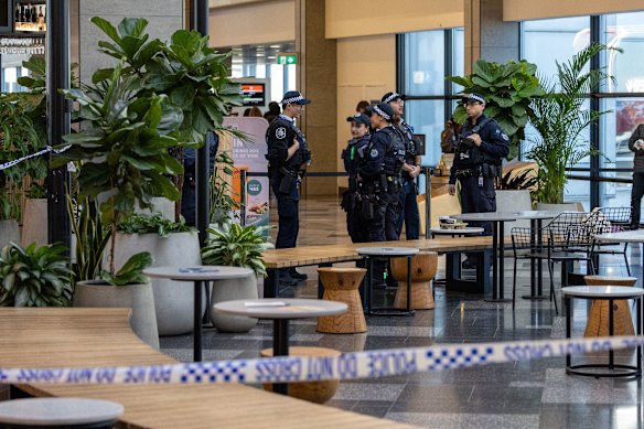 AFP officers standing outside gate 49 at Sydney Airport’s Terminal 2 on Wednesday.