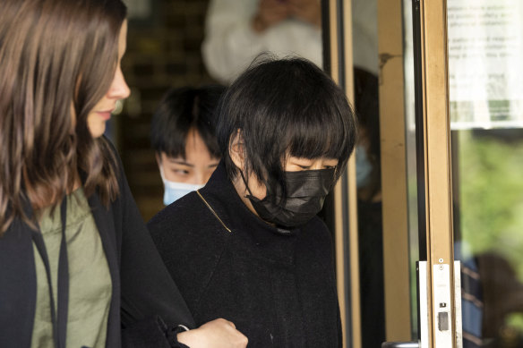 Li Wang, mother of Shuyu Zhou, leaves the courthouse in Darlinghurst on Monday. 