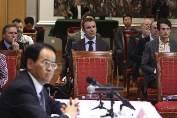 Journalists watching a video during a press conference with Chinese ambassador to Australia Cheng Jingye.