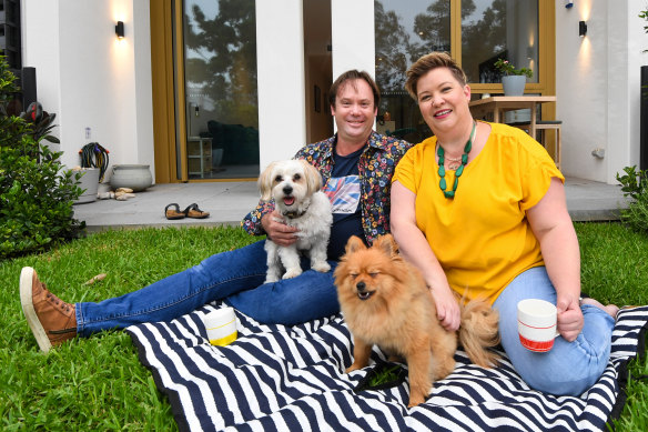 John and Ashka Broeksema, with dogs Murphy and Ziggy, at their new home in a build-to-rent apartment tower at Sydney Olympic Park. 