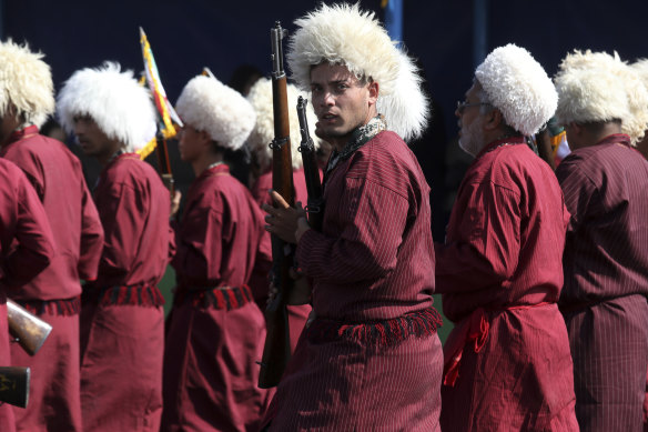 Wearing their traditional garments, a group of Iranian Turkmen, members of Basij paramilitary force, affiliated to the Revolutionary Guard, march last year. The Basij Cooperative Foundation, linked to the Basij militia was also sanctioned.
