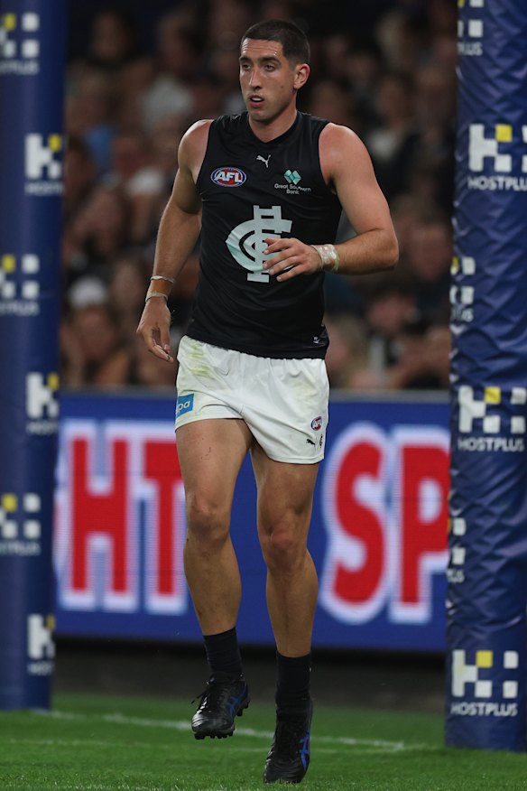 Jacob Weitering reacts after hurting his leg against North Melbourne.
