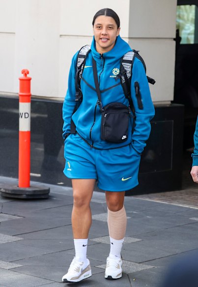 Sam Kerr leaves the Matildas’ team hotel in Sydney on Friday morning with a compression bandage on her left calf.