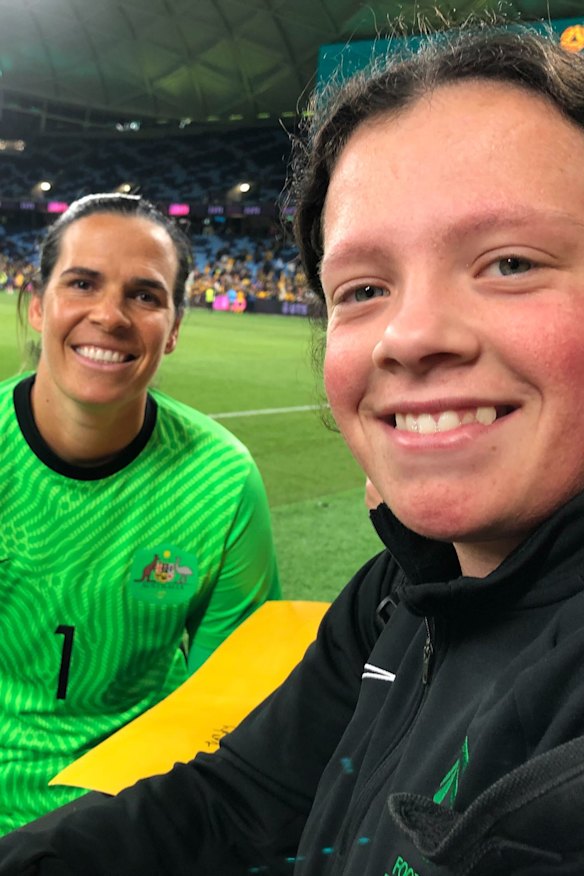 Football fanatic Katie Campbell, 15, with Matildas player Lydia Williams (left).