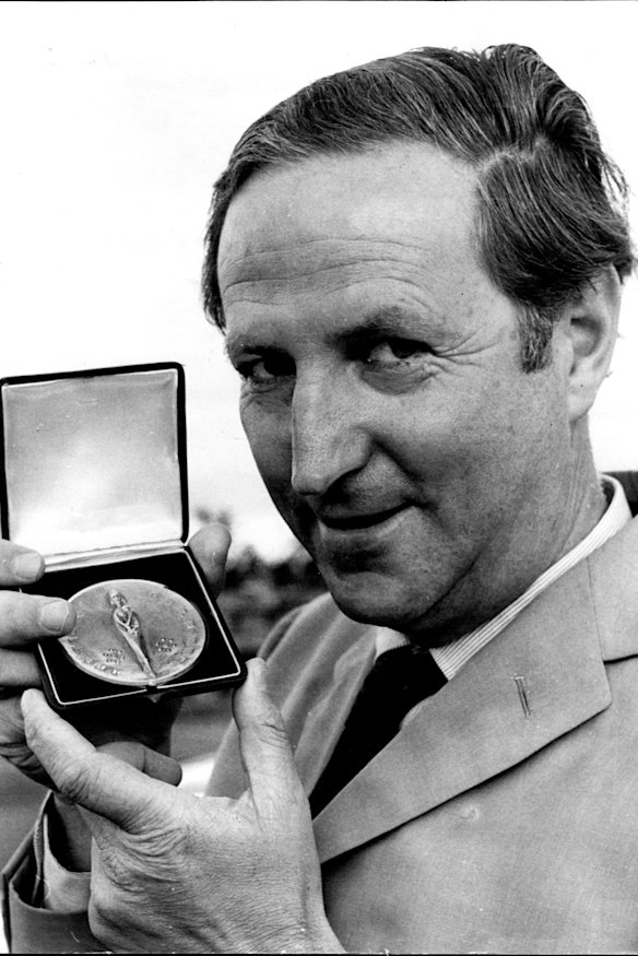 William McBride pictured at Sydney Airport holding the medal presented by the Institute De La Vie in Paris. 